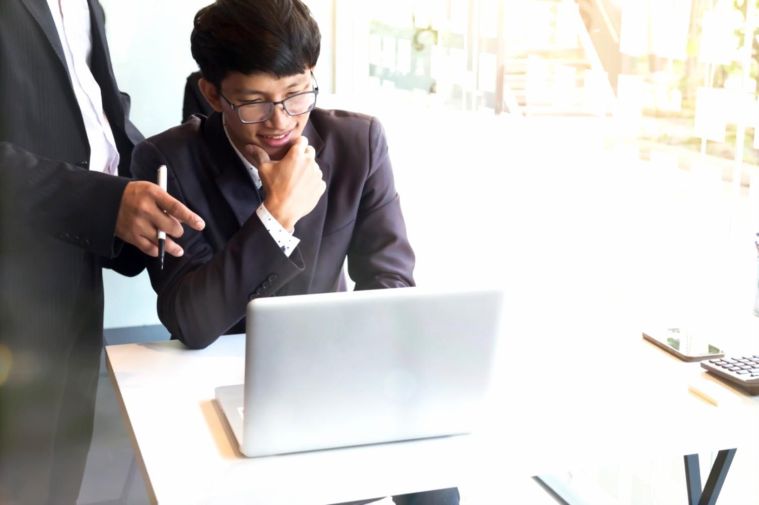 Professional team reviewing budget documents in modern office setting